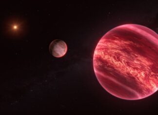 Obří satelit, který není planetou: první detekce planetárního hromadného exoměsíce